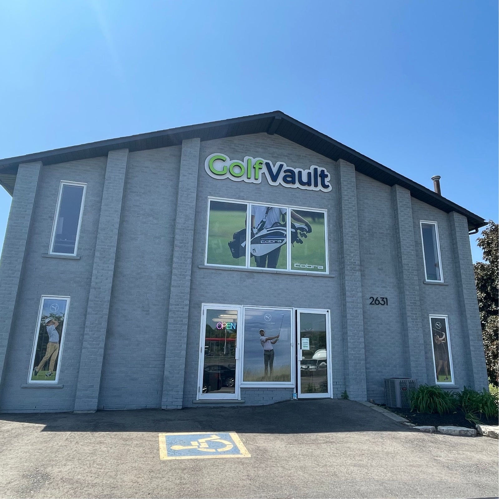 Golf vault store front building location with sign